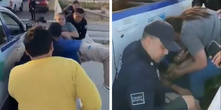 Captan momento exacto en el que policías evitan que un hombre salte de un puente